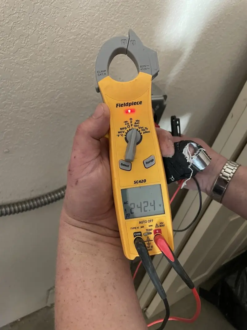 Voltage testing with clamp meter during Generator Installation in Baldwin